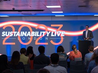 Sustainability LIVE London 2023 host Neil Perry on stage at the hybrid corporate event