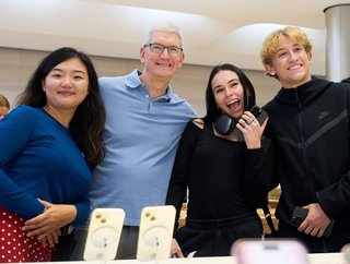 Apple CEO Tim Cook with customers at an Apple Store in New York City. Picture: Apple