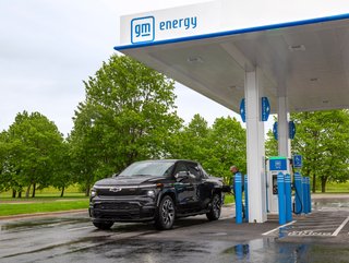2024 Chevrolet Silverado EV RST  pulling into a GM Energy charging station (Credit: GM)