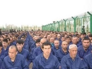 Uyghur detainees listening to speeches in a camp in Xinjiang province, China, in April 2017